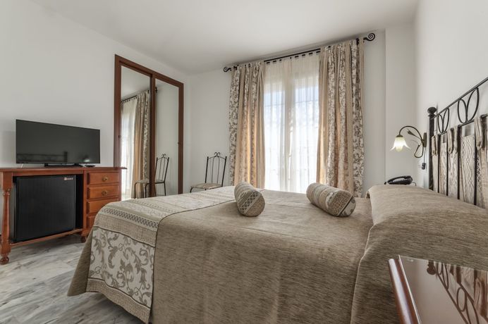 Imagen de la habitación del Hotel La Parrita. Foto 11