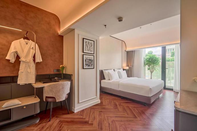 Imagen de la habitación del Hotel La Passion Saigon. Foto 7