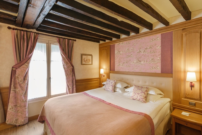 Imagen de la habitación del Hotel La Perle. Foto 15