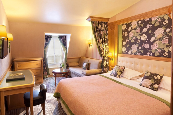Imagen de la habitación del Hotel La Perle. Foto 16