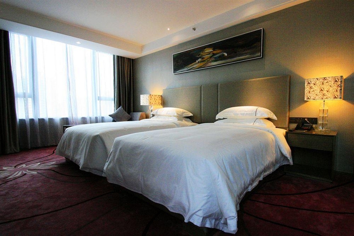 Imagen de la habitación del Hotel La Perle International. Foto 13