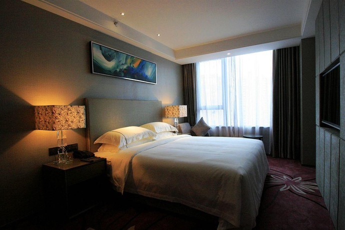 Imagen de la habitación del Hotel La Perle International. Foto 14