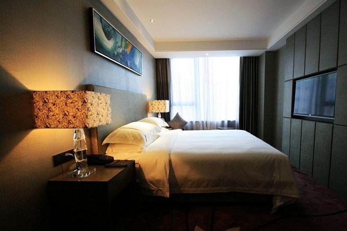 Imagen de la habitación del Hotel La Perle International. Foto 16