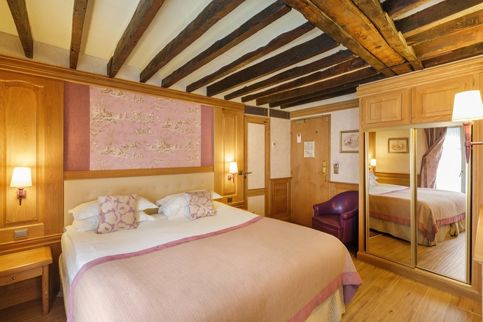 Imagen de la habitación del Hotel La Perle, París. Foto 13
