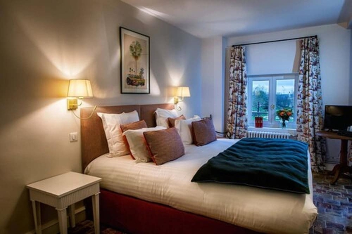 Imagen de la habitación del Hotel La Petite Folie. Foto 11