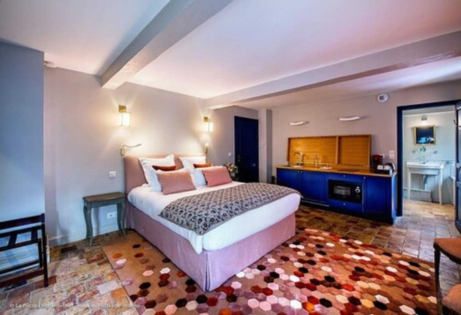 Imagen de la habitación del Hotel La Petite Folie. Foto 17