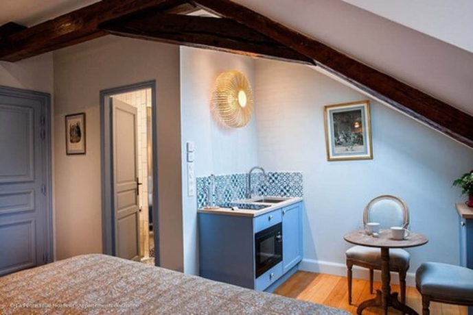 Imagen de la habitación del Hotel La Petite Folie. Foto 18