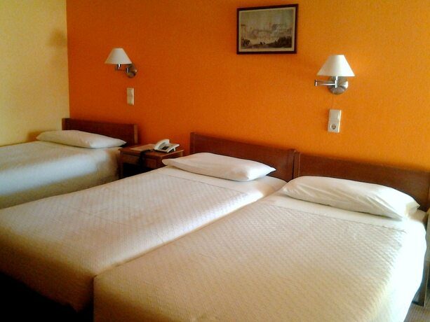 Imagen de la habitación del Hotel La Petite Planete. Foto 19