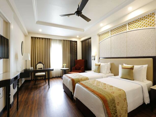 Imagen de la habitación del Hotel La Place Sarovar Portico, Lucknow. Foto 19