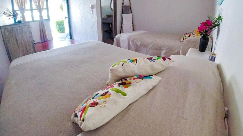 Imagen de la habitación del Hotel La Playita Beach House. Foto 7
