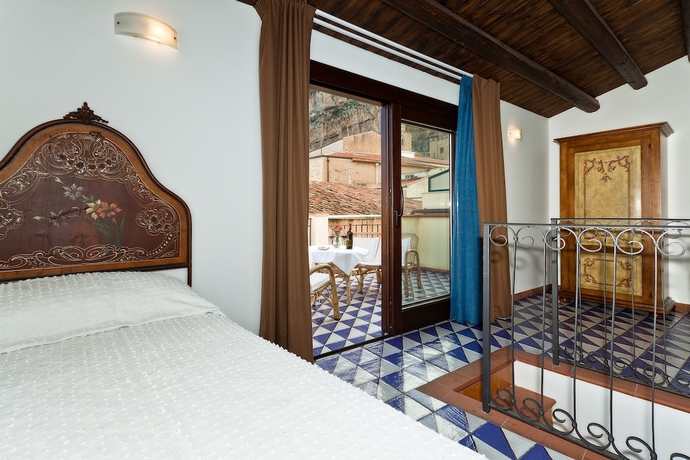 Imagen de la habitación del Hotel La Plumeria. Foto 15