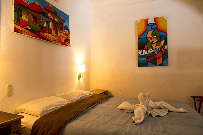 Imagen de la habitación del Hotel La Posada Del Sol. Foto 16