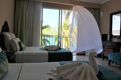 Imagen de la habitación del Hotel La Quinta Gran Bahia Cuastecomates. Foto 6