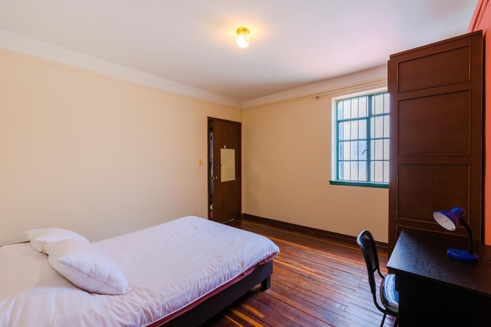 Imagen de la habitación del Hotel La Quinta - Hostel. Foto 12