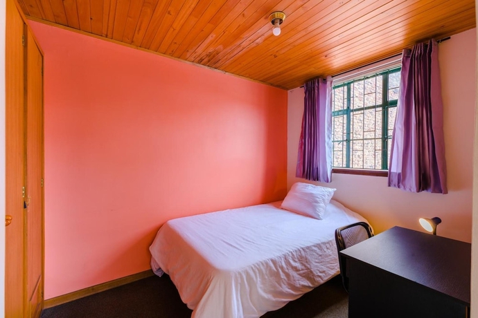 Imagen de la habitación del Hotel La Quinta - Hostel. Foto 15
