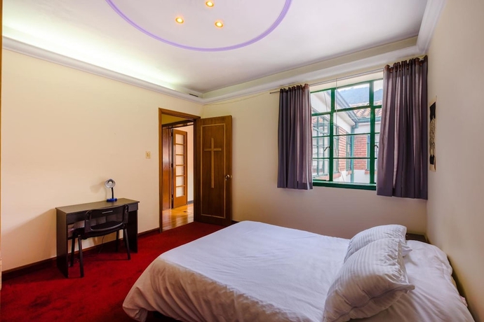 Imagen de la habitación del Hotel La Quinta - Hostel. Foto 17