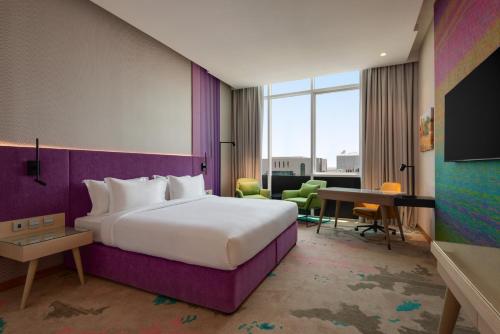 Imagen de la habitación del Hotel La Quinta by Wyndham Abu Dhabi Al Wahda. Foto 10