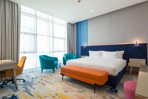 Imagen de la habitación del Hotel La Quinta by Wyndham Abu Dhabi Al Wahda. Foto 16