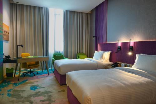 Imagen de la habitación del Hotel La Quinta by Wyndham Abu Dhabi Al Wahda. Foto 17