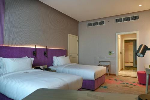 Imagen de la habitación del Hotel La Quinta by Wyndham Abu Dhabi Al Wahda. Foto 18