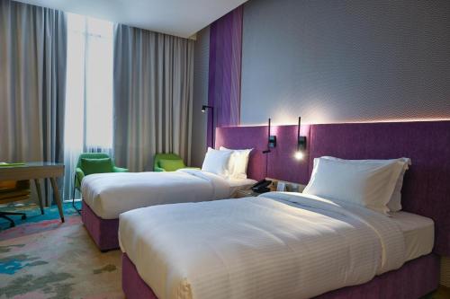 Imagen de la habitación del Hotel La Quinta by Wyndham Abu Dhabi Al Wahda. Foto 20