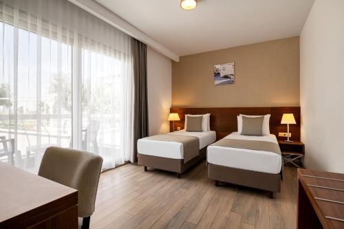 Imagen de la habitación del Hotel La Quinta by Wyndham Cesme. Foto 17