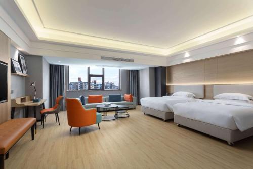 Imagen de la habitación del Hotel La Quinta by Wyndham Qionghai Yinhai. Foto 12