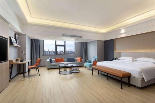 Imagen de la habitación del Hotel La Quinta by Wyndham Qionghai Yinhai. Foto 13