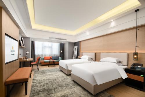 Imagen de la habitación del Hotel La Quinta by Wyndham Qionghai Yinhai. Foto 17