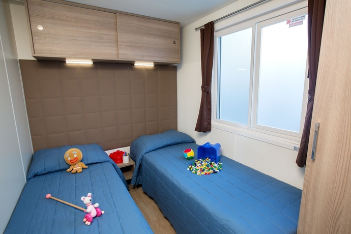 Imagen de la habitación del Hotel La Rocca Camping Village. Foto 8