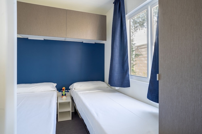 Imagen de la habitación del Hotel La Rocca Camping Village. Foto 10