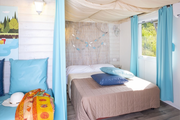 Imagen de la habitación del Hotel La Rocca Camping Village. Foto 14