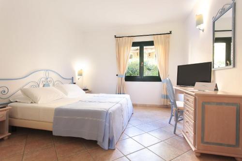 Imagen de la habitación del Hotel La Rocca Resort & Spa. Foto 8