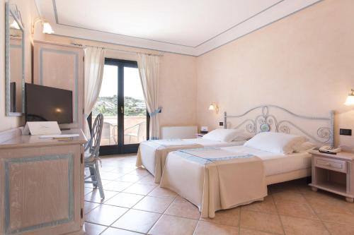Imagen de la habitación del Hotel La Rocca Resort & Spa. Foto 9