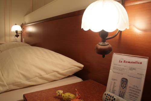 Imagen de la habitación del Hotel La Romantica. Foto 12