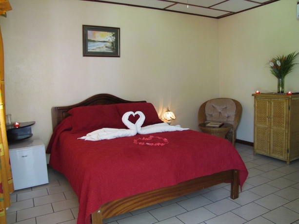 Imagen de la habitación del Hotel La Rosa De America. Foto 12