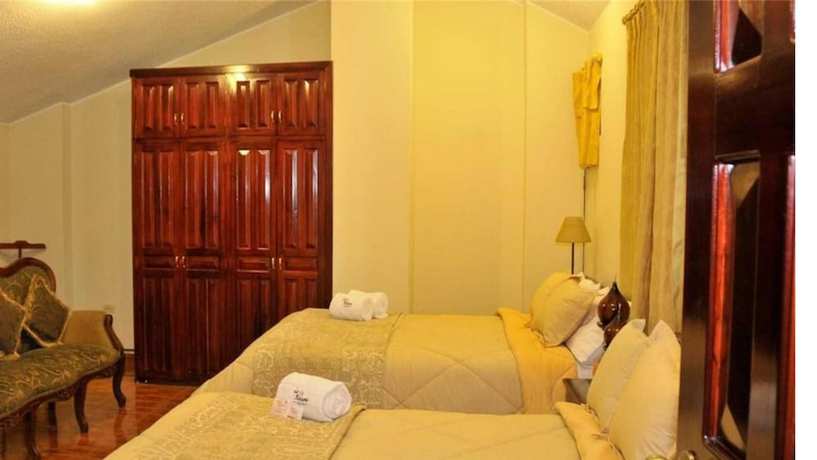 Imagen de la habitación del Hotel La Rosario. Foto 11