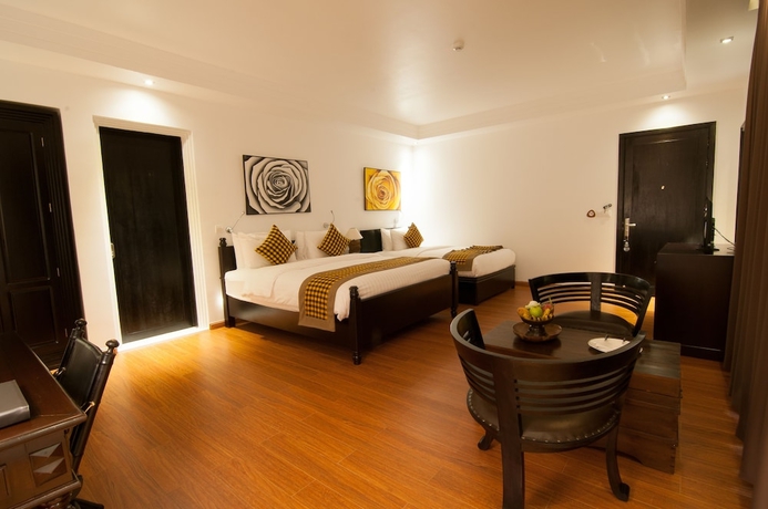 Imagen de la habitación del Hotel La Rose Suites. Foto 10