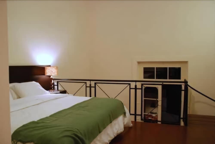 Imagen de la habitación del Hotel La Rozada Suites. Foto 9