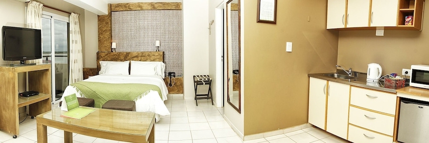 Imagen de la habitación del Hotel La Rozada Suites. Foto 12