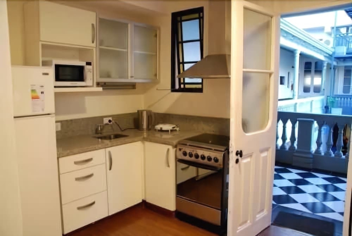 Imagen de la habitación del Hotel La Rozada Suites. Foto 14