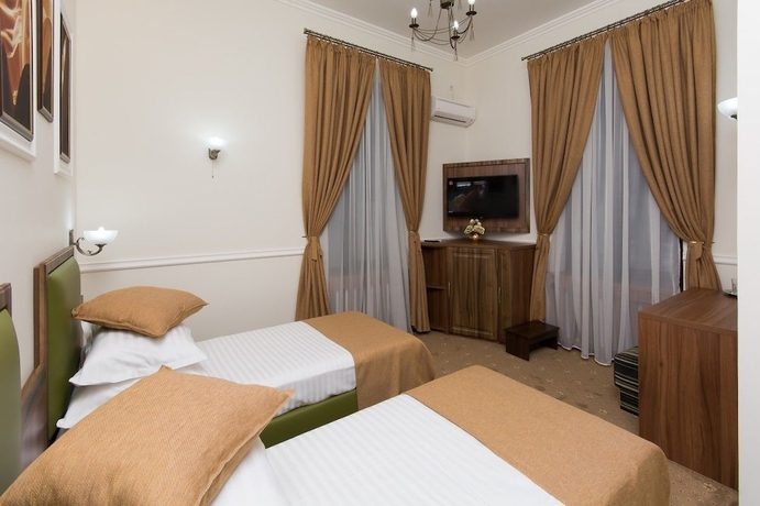 Imagen de la habitación del Hotel La Strada Boutique Villa. Foto 3