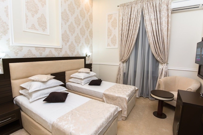 Imagen de la habitación del Hotel La Strada Boutique Villa. Foto 11