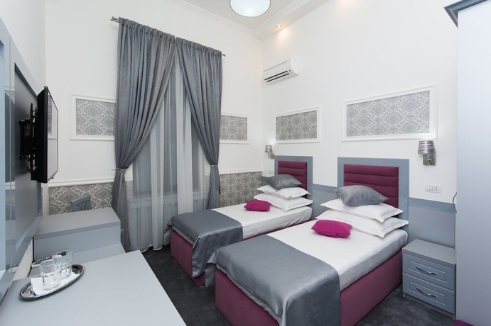 Imagen de la habitación del Hotel La Strada Boutique Villa. Foto 13