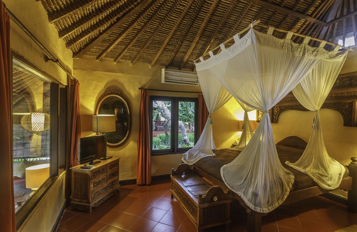 Imagen de la habitación del Hotel La Taverna Suites. Foto 7