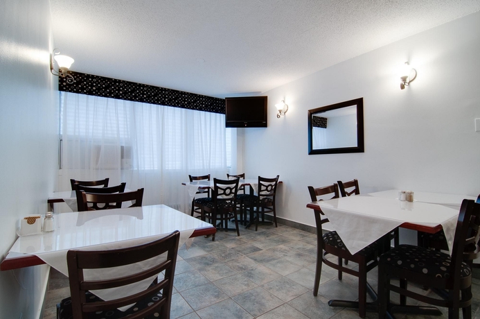 Imagen del bar/restaurante del Hotel La Tour Belvedere Apartment. Foto 3