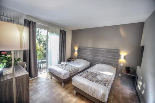 Imagen de la habitación del Hotel La Tour Carrée - Grasse Sud. Foto 3