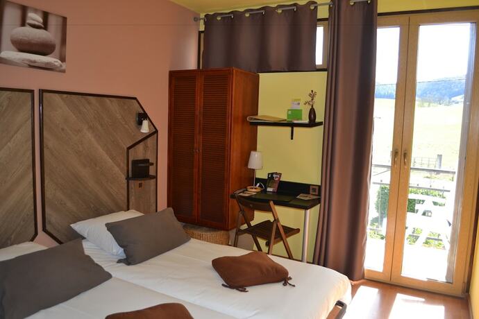 Imagen de la habitación del Hotel La Tour du Loup. Foto 14