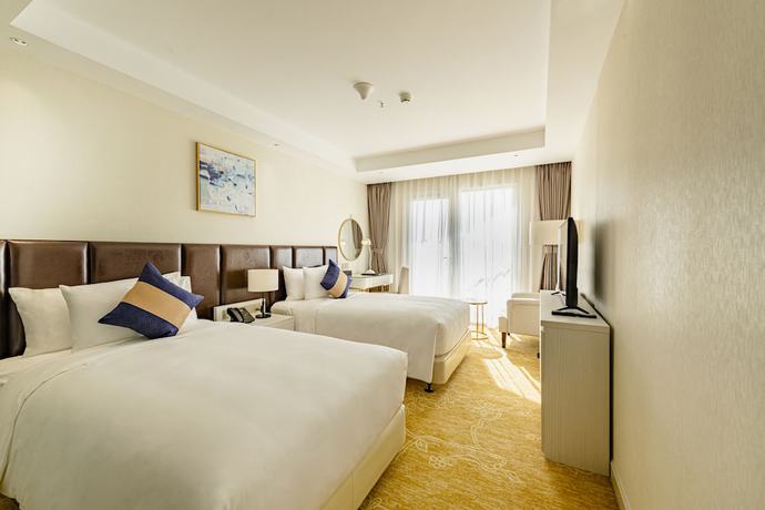 Imagen de la habitación del Hotel La Vela Saigon. Foto 11