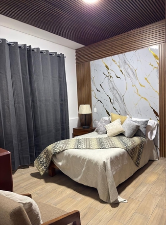Imagen de la habitación del Hotel La casa de las palmeras. Foto 3